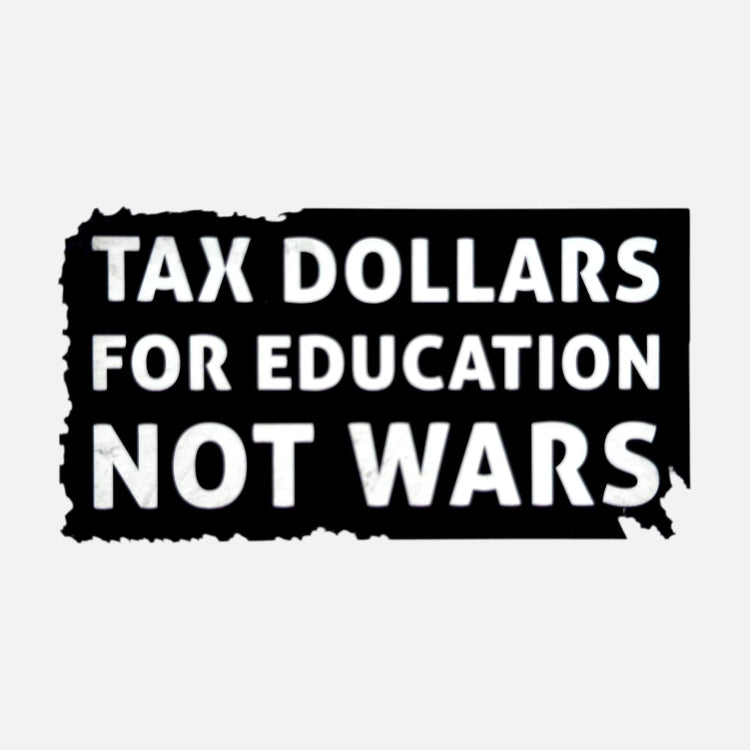A black bumper sticker with a distressed, torn-edge design featuring the text 'TAX DOLLARS FOR EDUCATION NOT WARS' in bold white capital letters, shown on a light gray background.