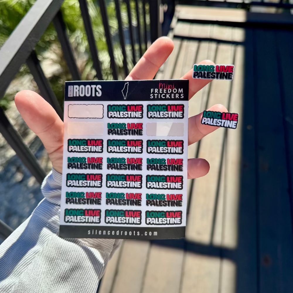 Hand holding a sticker pack with 'Long Live Palestine' stickers against a blurred outdoor background.