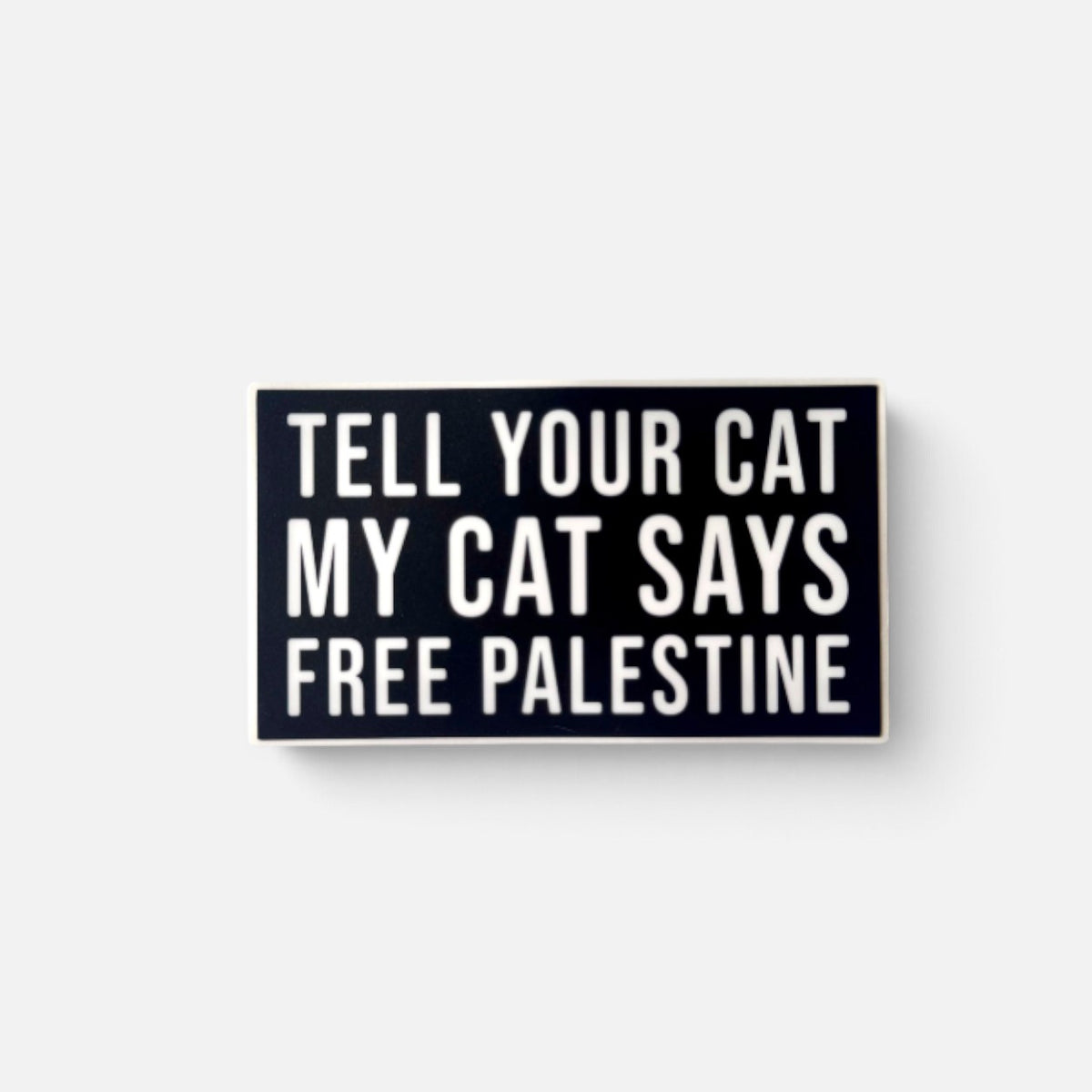 Silenced Roots bumper sticker with white text on a black background reading Tell Your Cat My Cat Says Free Palestine