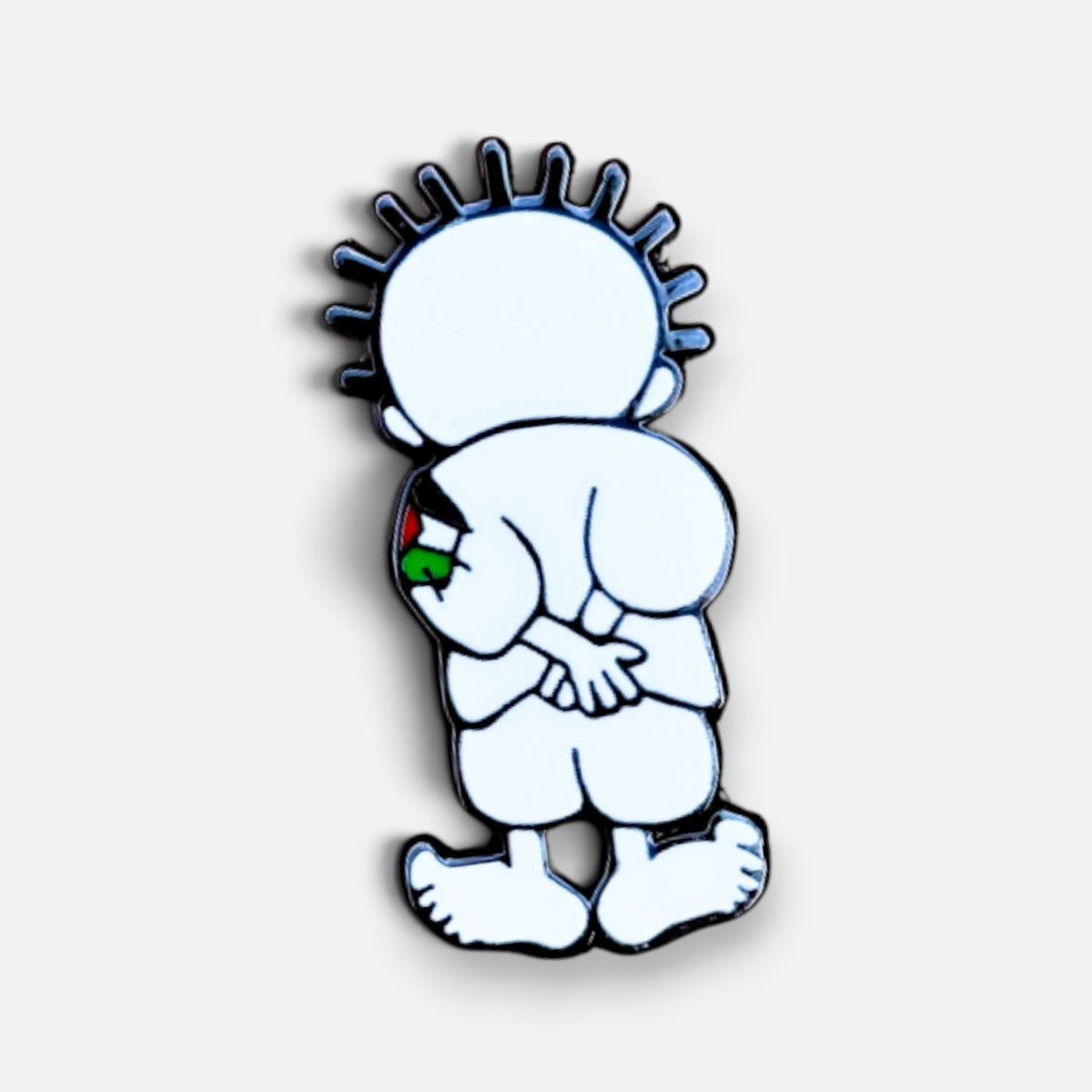 Silenced Roots Handala enamel pin featuring a white cartoon boy facing away with hands clasped behind his back