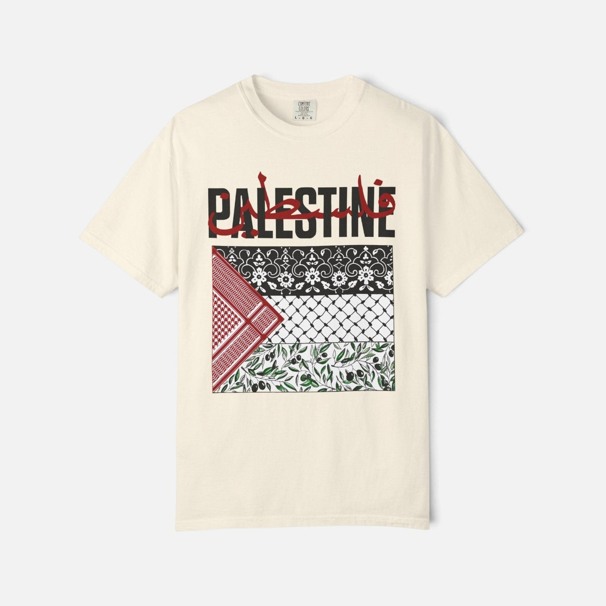 Silenced Roots cream graphic tee featuring Palestine typography and layered keffiyeh patterns in a relaxed unisex fit.