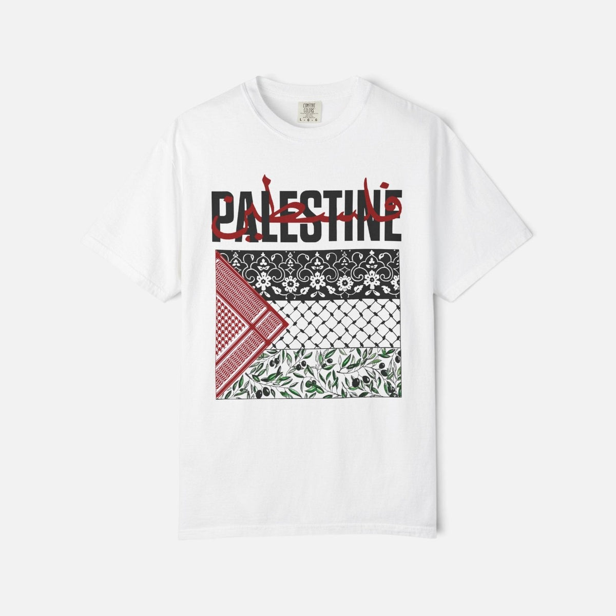Silenced Roots white graphic tee featuring a Palestine keffiyeh-inspired print with olive branches and calligraphy.
