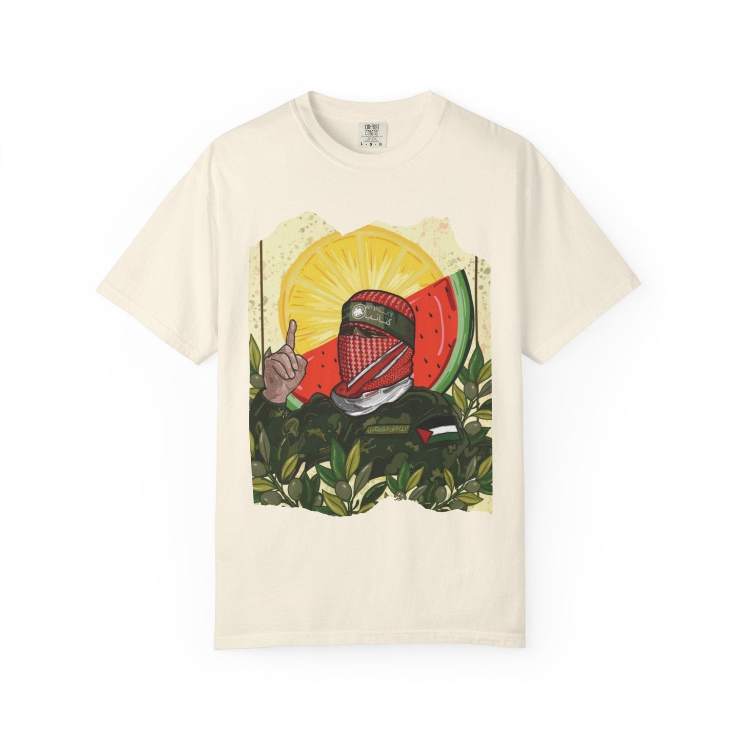 Silenced Roots cream Comfort Colors tee featuring Palestinian resistance artwork with a keffiyeh-clad figure.