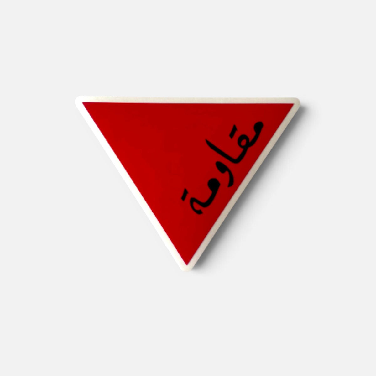 Silenced Roots red triangle sticker featuring the Arabic word for resistance in black calligraphy