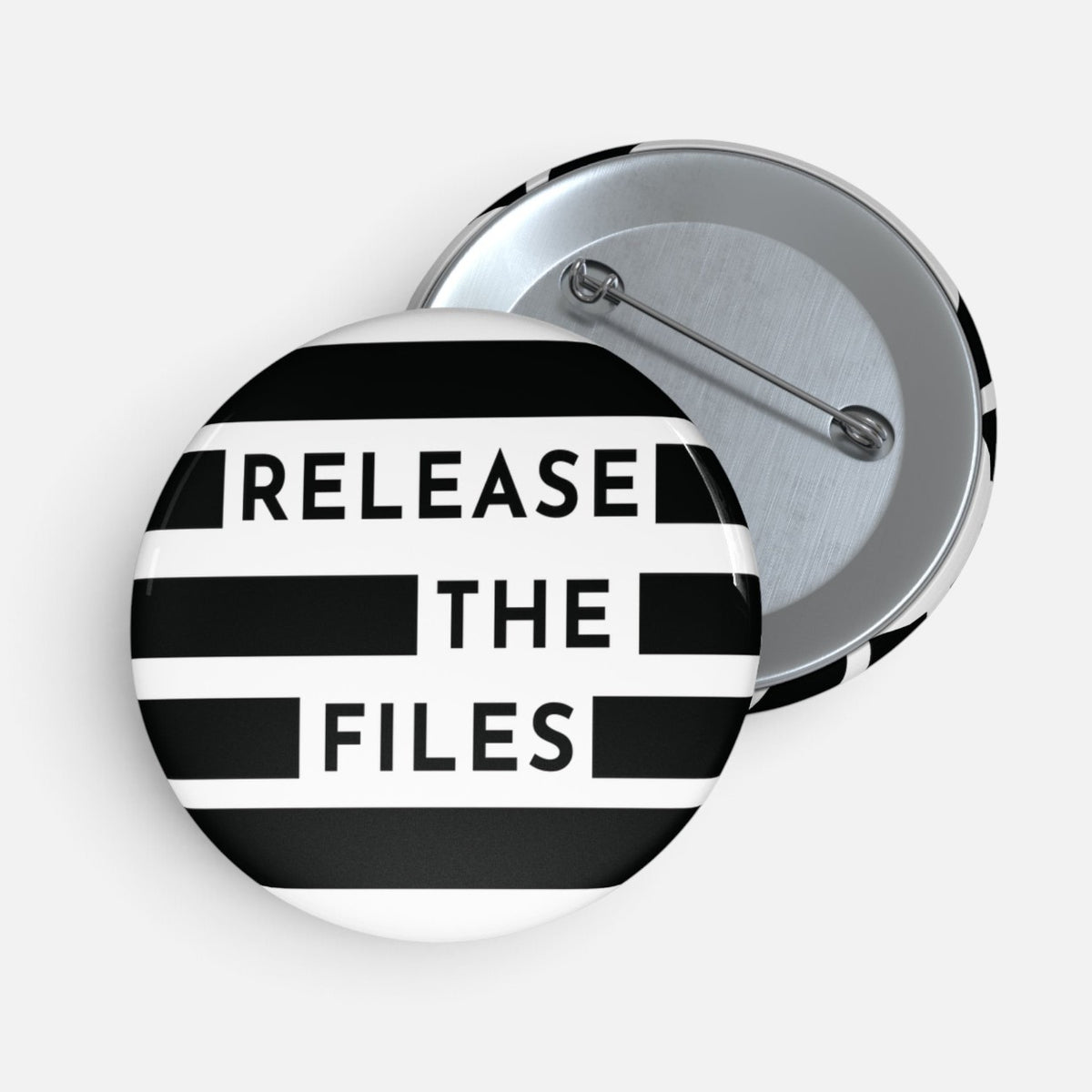 Silenced Roots Release the Files pin button with black and white striped graphic and steel safety pin backing
