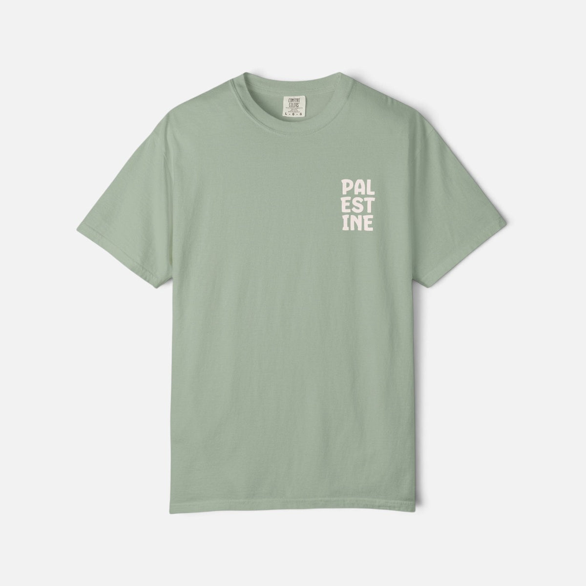 Silenced Roots sage green unisex t-shirt with a minimalist Palestine text print on the chest in a vintage style.